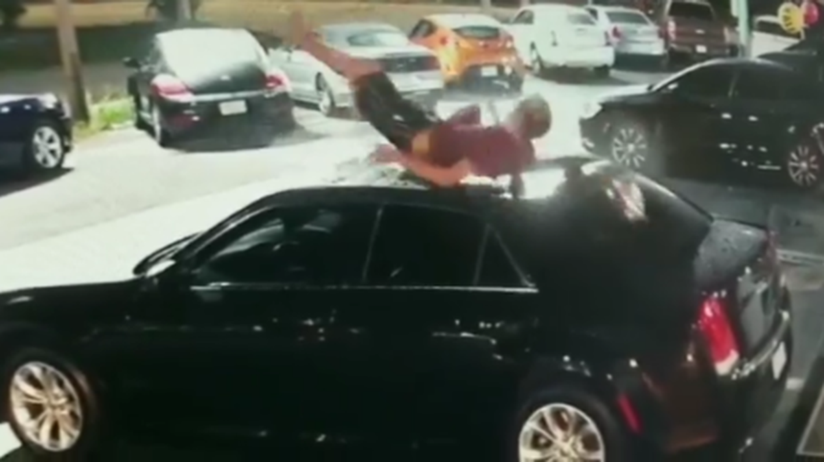 Florida man falls on car at car lot