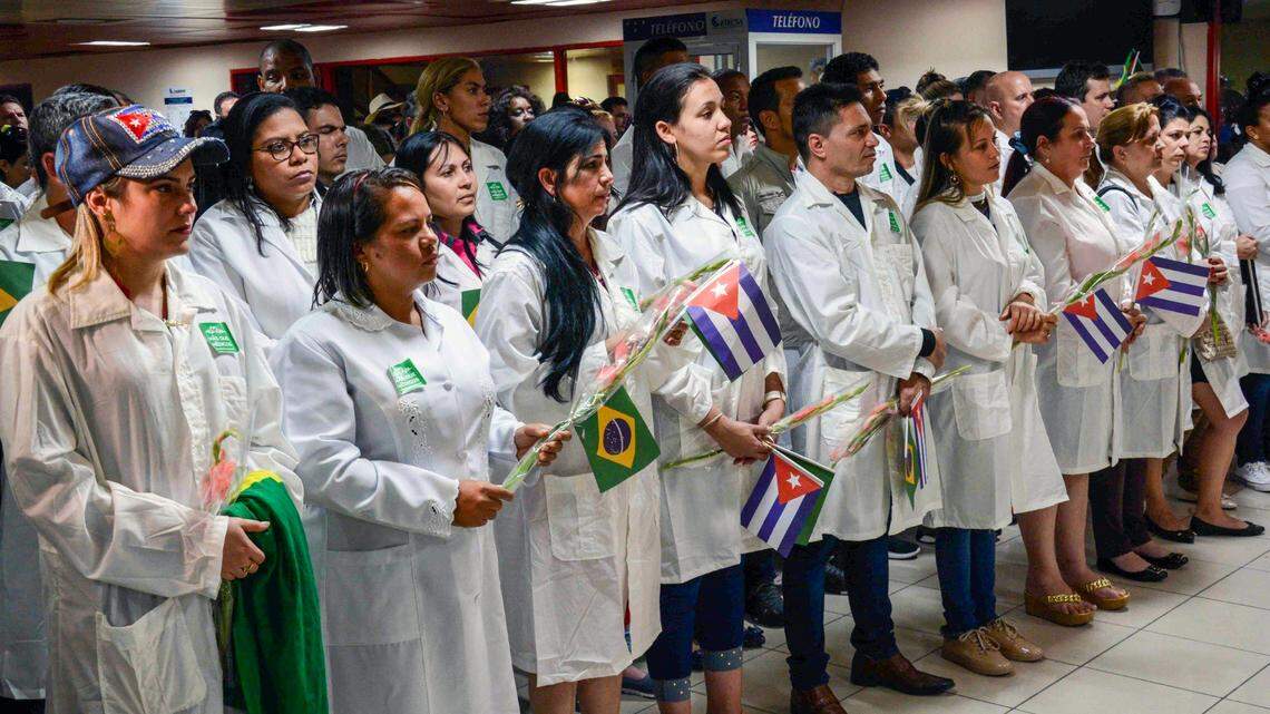 This handout picture released by Cuban News Agency (ACN) shows the first group of doctors who arrived from Brazil, after the Cuban government decided to pull them out of a medical aid program.