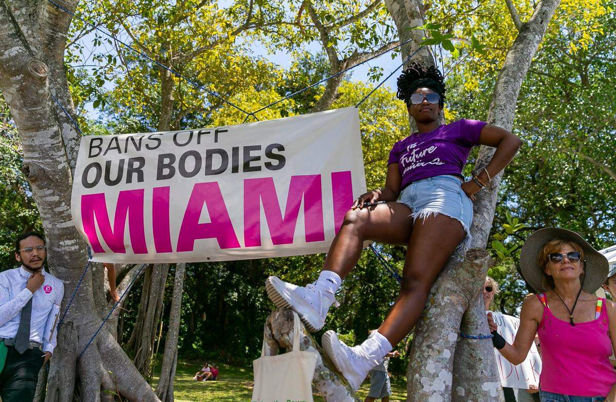 Ashley Samuel, center, from downtown Miami, at the Bans Off Our Bodies rally at Ives Estates Park in Miami May 14.