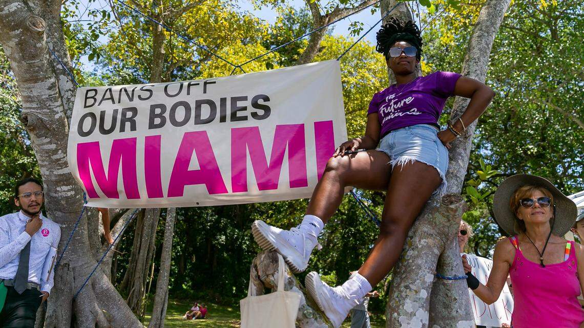 Ashley Samuel, center, from downtown Miami, at the Bans Off Our Bodies rally at Ives Estates Park in North Miami Beach, May 14, 2022.