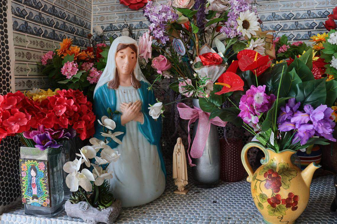 The figure of virgin seen in an altar in the front porch of the Lopez family mobile home at 11235 NW Flagler Lane at the Li'l Abner Mobile Home Park in Sweetwater, Florida, Monday, October 20, 2025.