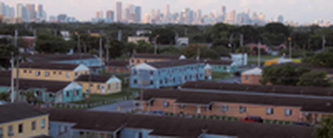 An overhead shot of the old Liberty Square with the Miami skyline in the background in the documentary “Razing Liberty Square.” Set to release Jan. 29 on PBS, “Razing Liberty Square” explores how climate gentrification led to the redevelopment of the Liberty Square public housing project.