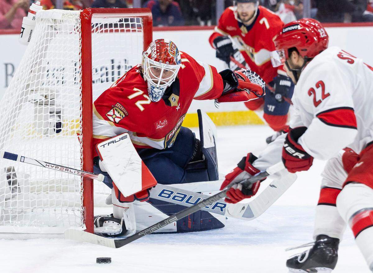 Florida Panthers goaltender Sergei Bobrovsky (72) defends as Carolina Hurricanes center Logan Stankoven (22) tries to score in the first period of Game 4 during the Eastern Conference final of the NHL Stanley Cup playoffs at Amerant Bank Arena on Monday, May 26, 2025, in Sunrise, Fla.