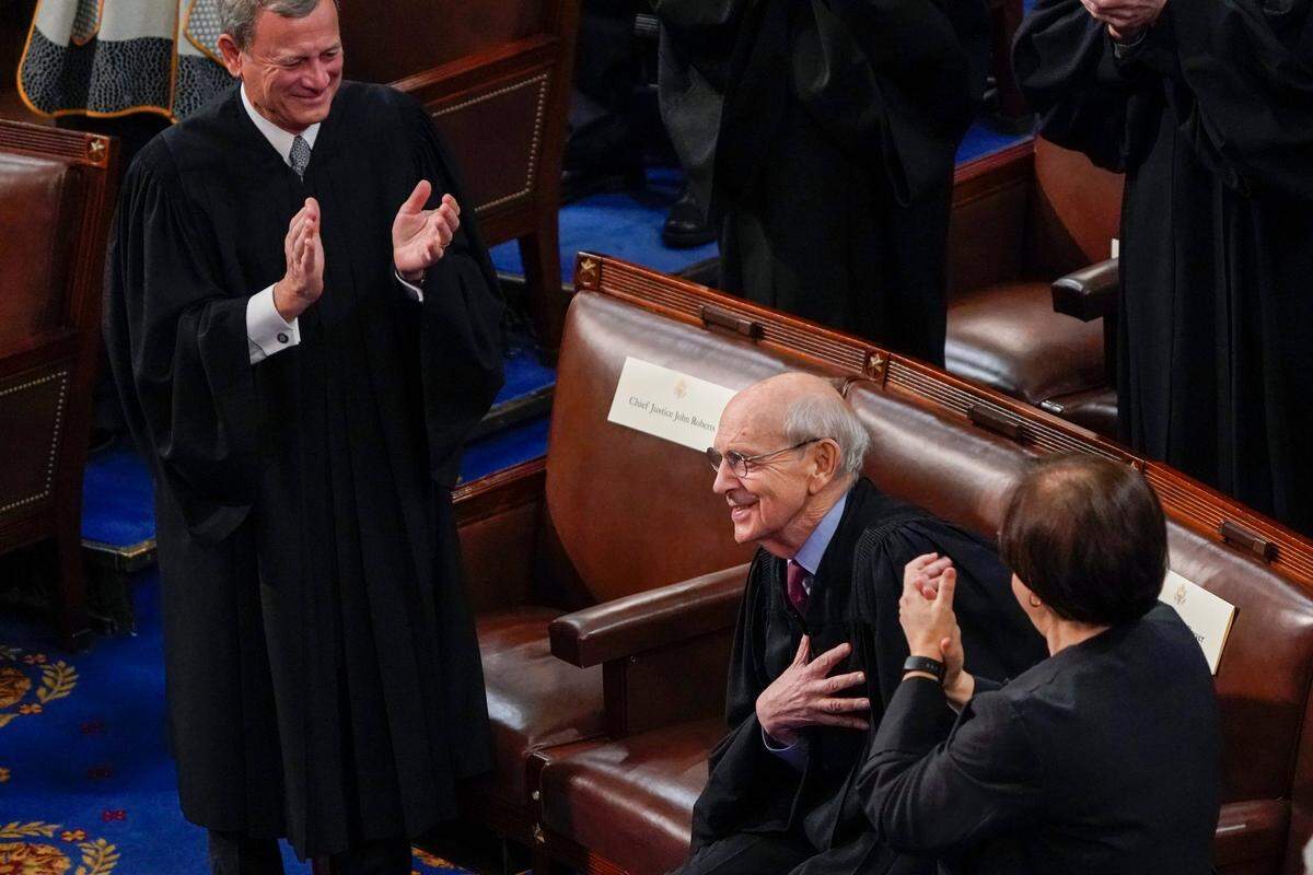 Chief Justice of the United States John Roberts and Supreme Court Associate Justice Elena Kagan applaud retiring Supreme Court Associate Justice Stephen Breyer as President Joe Biden delivers his first State of the Union address to a joint session of Congress, at the Capitol in Washington, Tuesday, March 1, 2022.