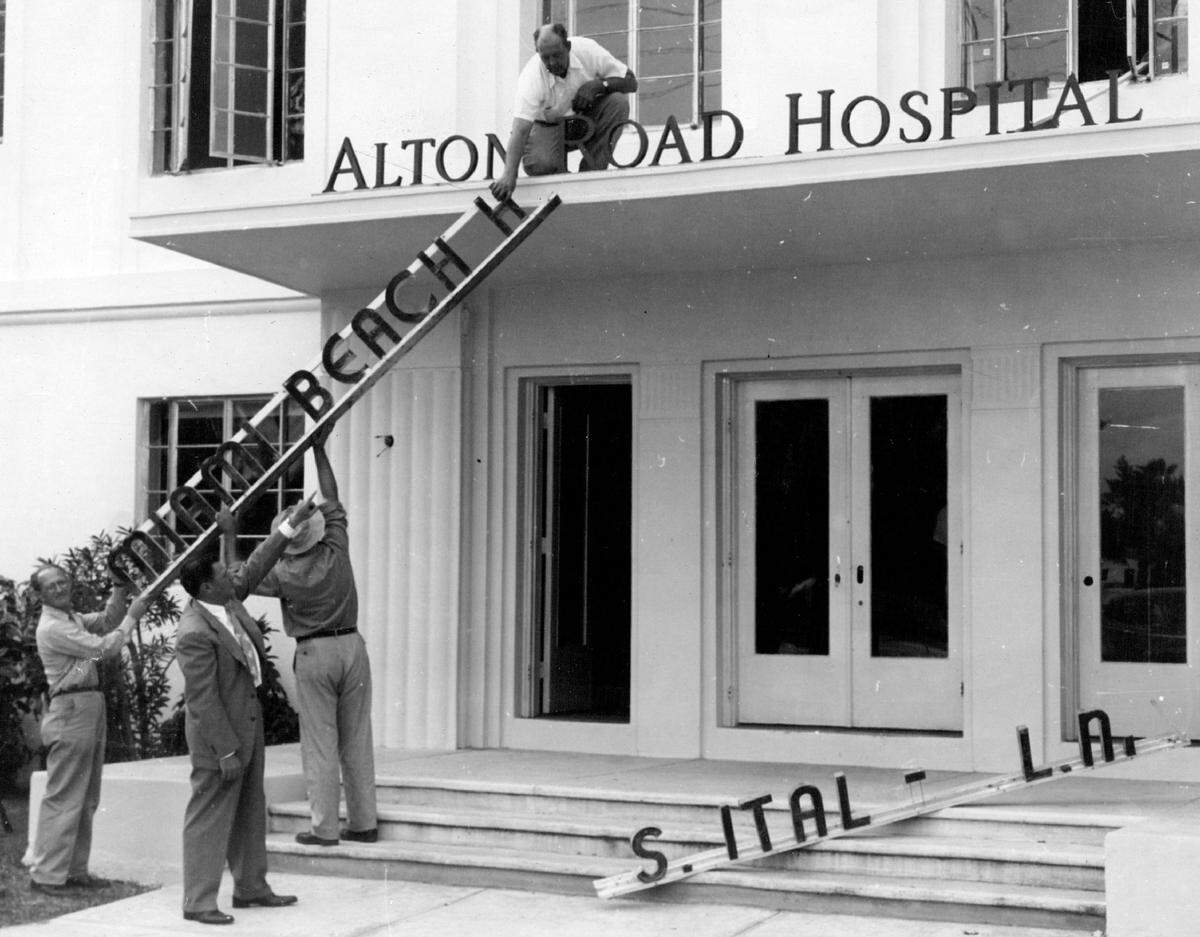The old “Miami Beach Hospital” sign is removed to make way for “Alton Road Hospital.” The hospital was operated by Mount Sinai until its new site was completed.