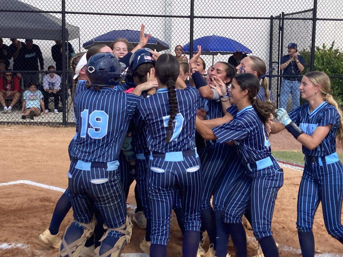 Coral Springs Charter’s players huddle up to celebrate after the Panthers beat Cardinal Gibbons 3-0 in the Region 4-3A final at Gibbons High School.
