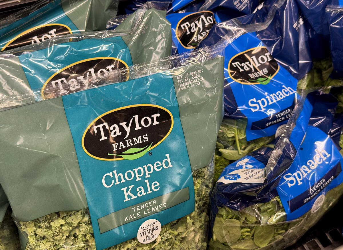 KINGS BEACH, CALIFORNIA - JULY 16: Packages of Taylor Farms salad greens are displayed at a Safeway store on July 16, 2026, in Kings Beach, California. Federal health officials are investigating whether shredded iceberg lettuce supplied by California-based Taylor Farms was the source of a nationwide Cyclospora outbreak that has sickened more than 1,600 people in 34 states, though no definitive link has been confirmed.