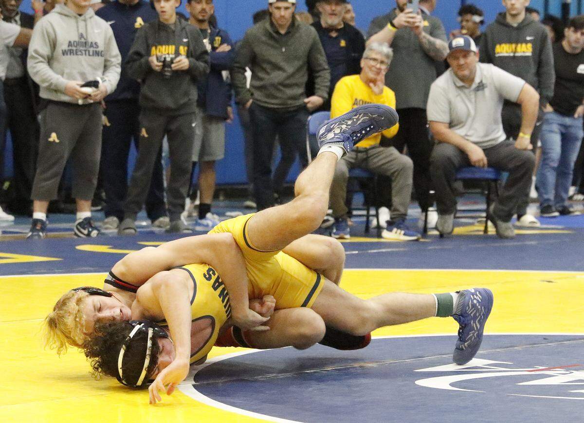 Ivan Kyryianenko of South Broward HS wrestlers Vincient Williams of St. Thomas Aquinas HS in the 144-pound championship match at the BCAA Wrestling Championships on Saturday, February 7, 2026 at Dillard HS in Fort Lauderdale. Ivan Kyryianenko won the match. Andrew Uloza / for Miami Herald