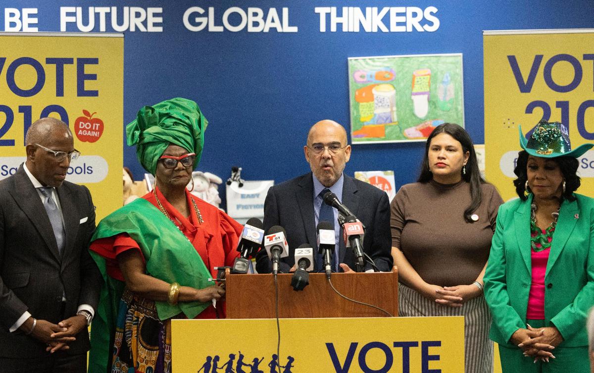 Jose Dotres, superintendent of Miami-Dade County Public Schools, center, speaks with School Board members Dorothy Bendross-Mindingall, left, and Lucia Baez-Geller, during a press conference, Thursday, Oct. 6, 2022, at Madie Ives K-8 Center in Miami to promote the Nov. 8 referendum. The district is asking voters to boost their property taxes to fund teacher raises and school resource officers.