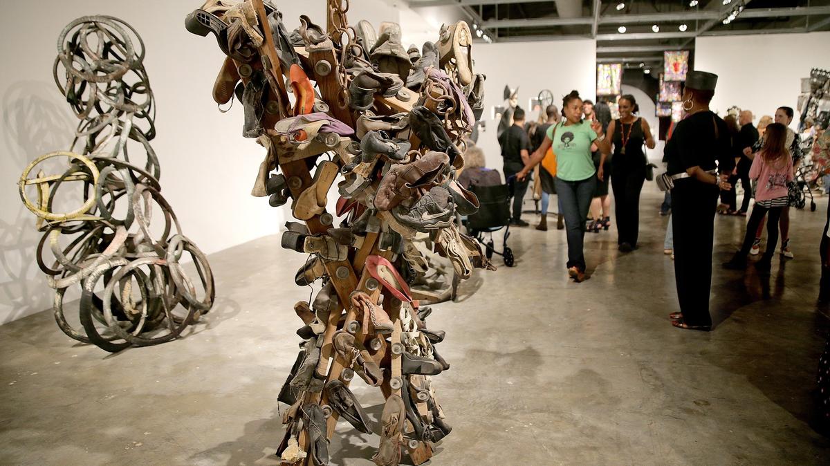 This art work consisting of old pairs of shoes was designed by Haiti-based artist Jean Hérard Céleur. It is part of the exhibit “PÒTOPRENS: The Urban Artists of Port-au-Prince” at the Museum of Contemporary Art in North Miami.