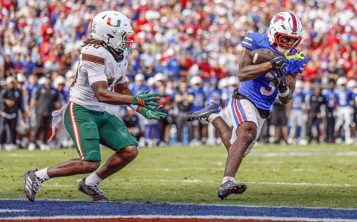 Southern Methodist University Mustangs safety Ahmaad Moses (3) intercepts a pass intended for Miami Hurricanes wide receiver Malachi Toney (10) in overtime during an NCAA football game at Gerald Ford Stadium on Saturday, November 1, 2025, in Dallas, Texas.