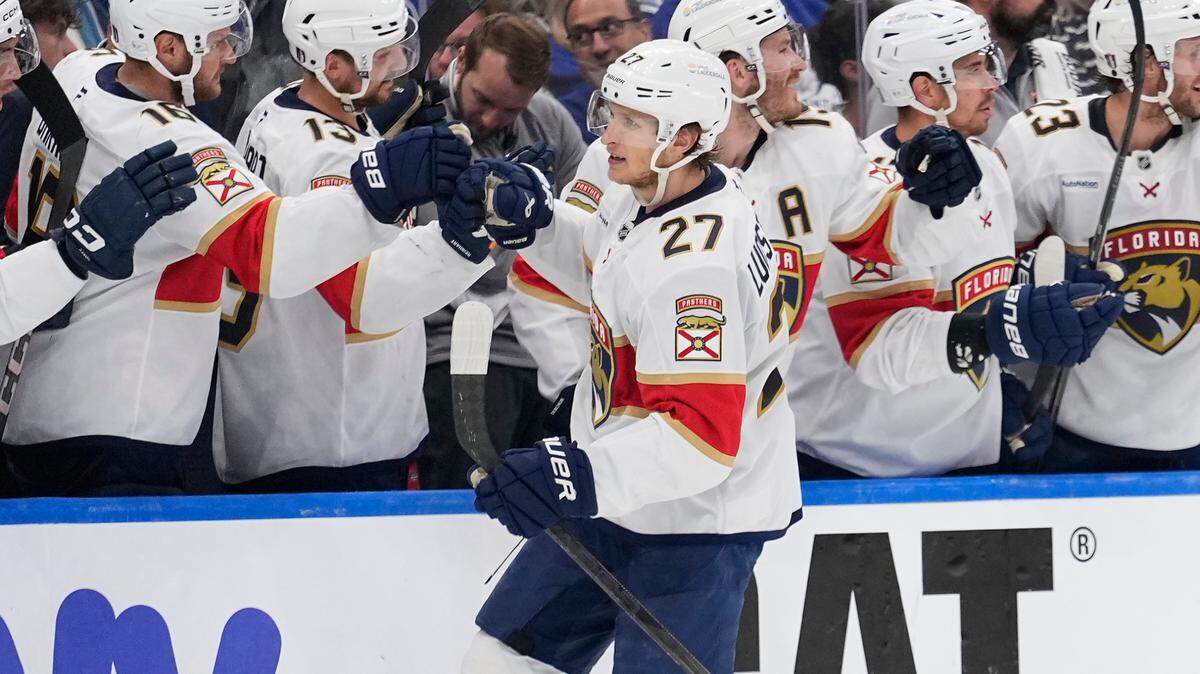 May 18, 2025; Toronto, Ontario, CAN; Florida Panthers forward Eetu Luostarinen (27) is congratulated by teammates after scoring against the Toronto Maple Leafs during the third period of game seven of the second round of the 2025 Stanley Cup Playoffs at Scotiabank Arena. Mandatory Credit: John E. Sokolowski-Imagn Images