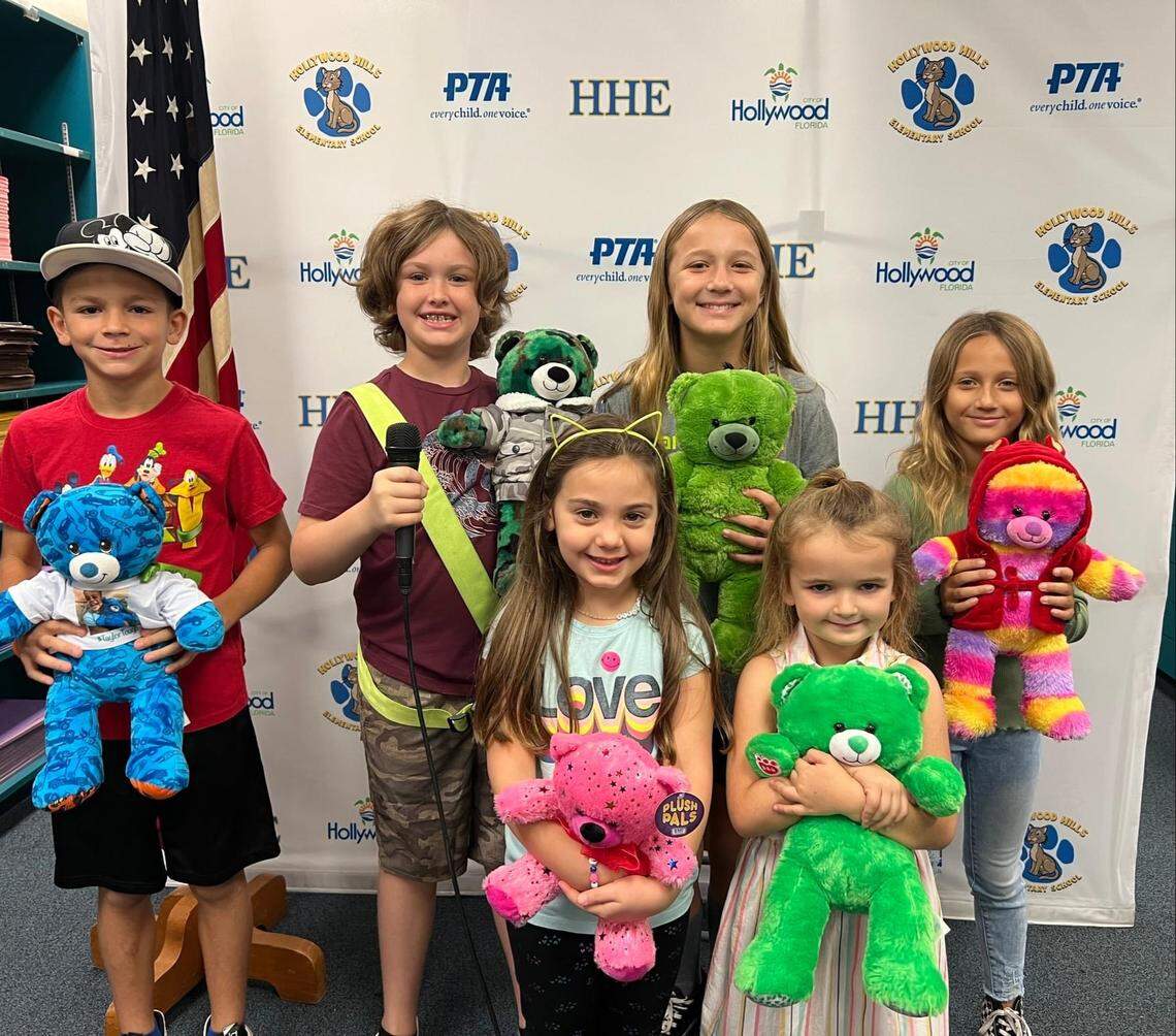 A photo of Hollywood Hills Elementary School students holding up teddy bears. The school collected teddy bears to donate them to first responders in Taylor Bishop’s memory.