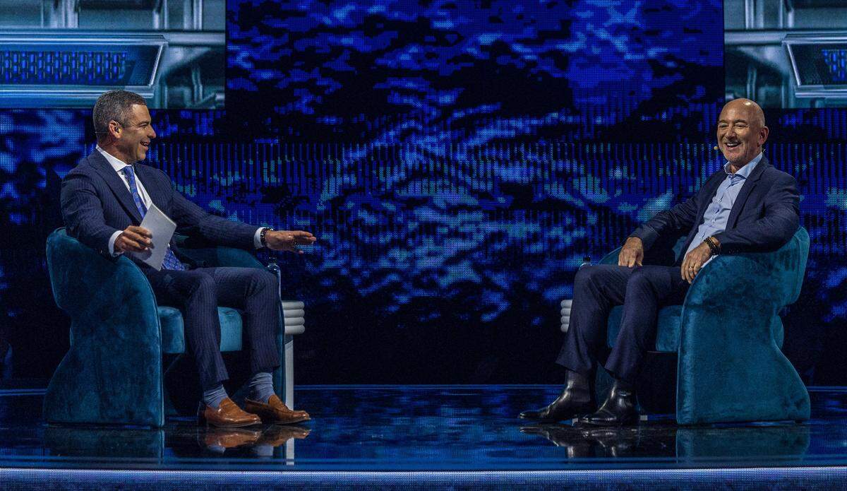 Miami Mayor Francis Suarez interviews Jeff Bezos during the final day of the America Business Forum at the Kaseya Center.