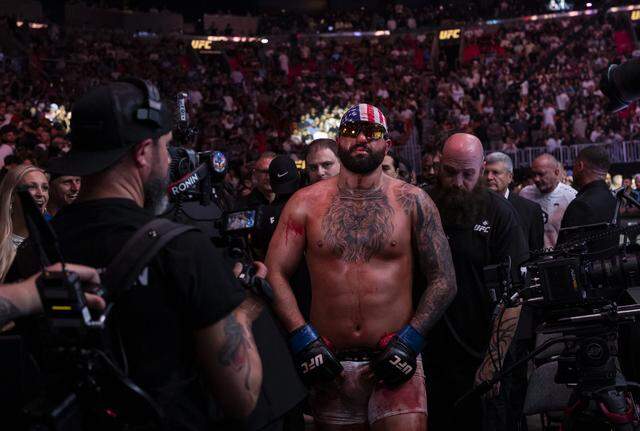 Josh Hokit of the United States leaves after defeating Curtis Blaydes of the United States in their heavyweight bout at UFC 327 at the Kaseya Center on Saturday, April 11, 2026, in downtown Miami, Fla.