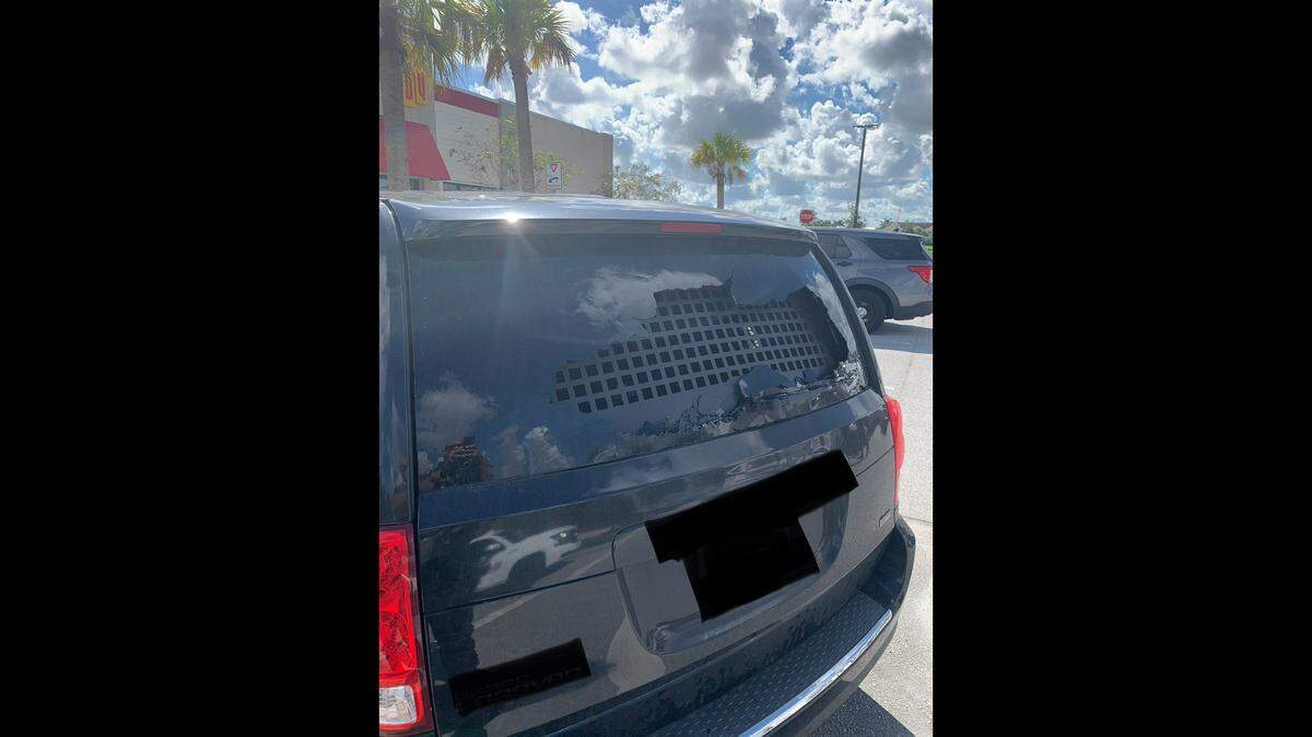 The vehicle was near a WaWa store on Village Parkway in Port St. Lucie when the rock shattered the back window, police said.   