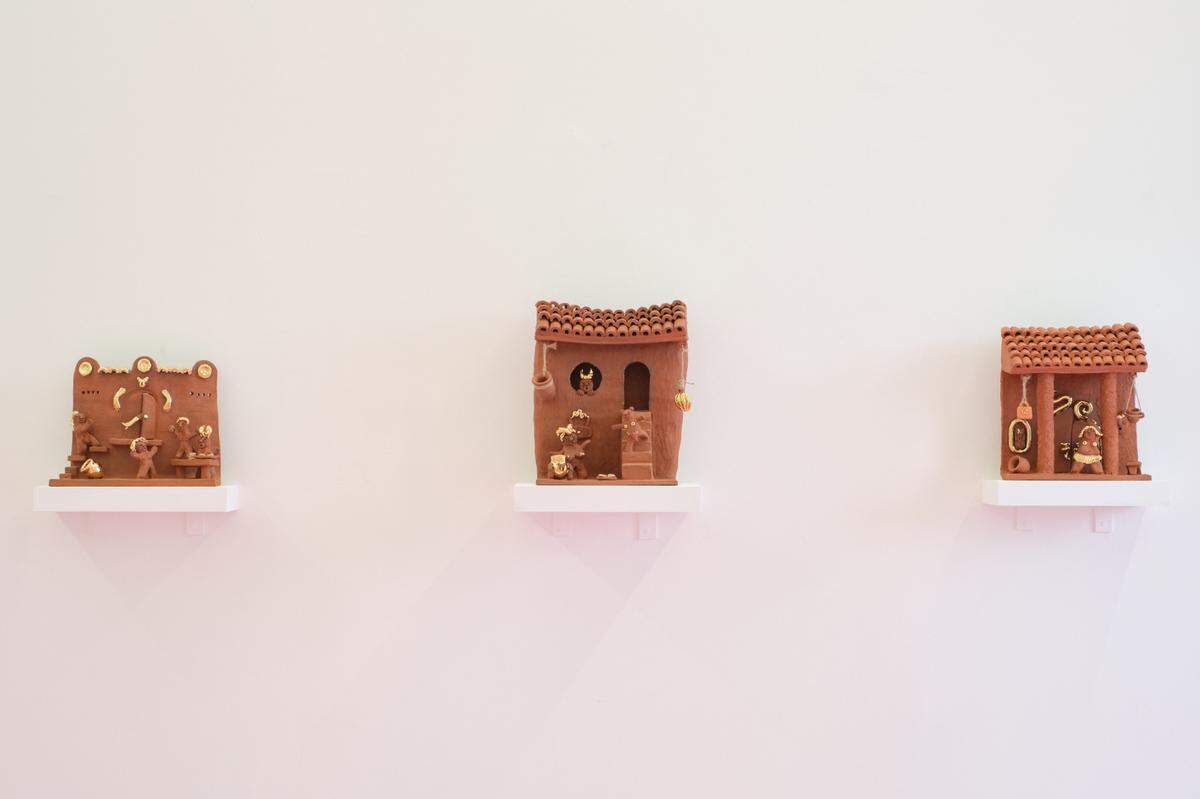 Artist Joel Gaitan’s “casitas” sculptures are inspired by the miniature house decorations found in many Latino homes. The works are on display at his show “En El Corazón Del Infierno, En Las Alturas Del Cielo” at KDR.