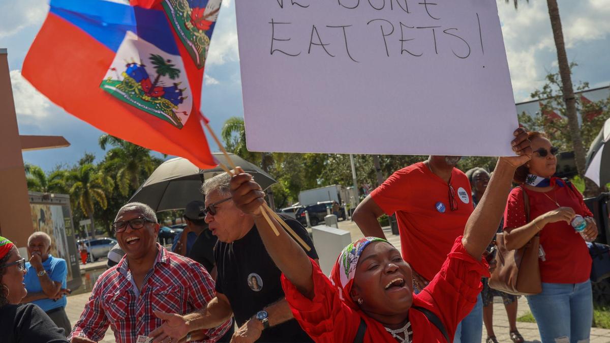 West Palm Beach resident Wilda Brooks, center, protest along with members of South Florida’s Haitian community as Miami-Dade Democratic Haitian Caucus hosted a rally against the rhetoric of former President Donald Trump and running mate J.D. Vance, the importance of registration to vote, and participation in the election this November 5th on Sunday, September 22, 2024, in North Miami, Florida.