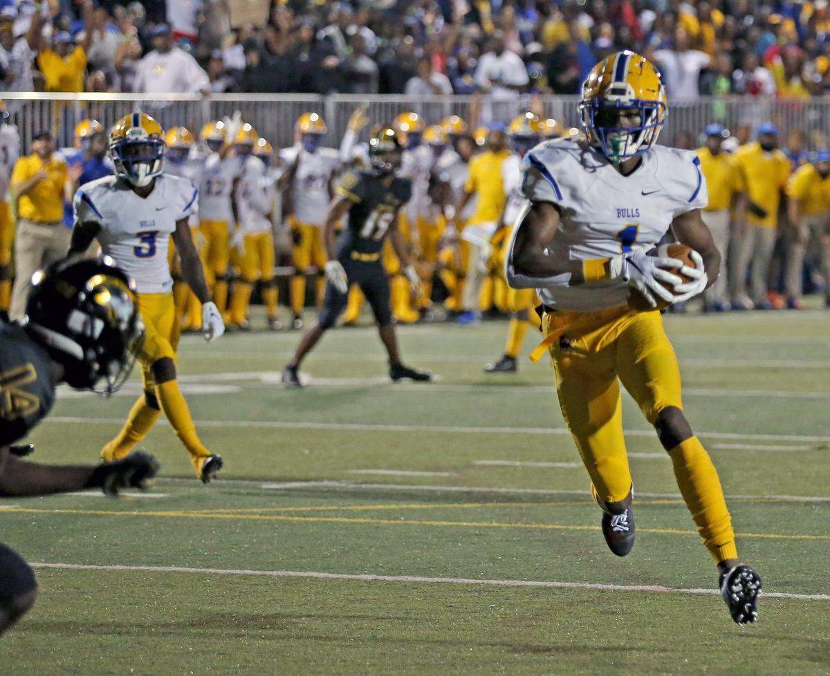 Miami Northwestern Romello Brinson (1) scores in the first quarter as they play American Heritage at American Heritage HS in Plantation, Florida, Friday, November, 22, 2019.