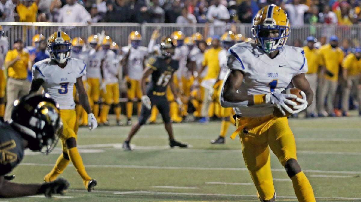 Miami Northwestern Romello Brinson (1) scores in the first quarter as they play American Heritage at American Heritage HS in Plantation, Florida, Friday, November, 22, 2019.