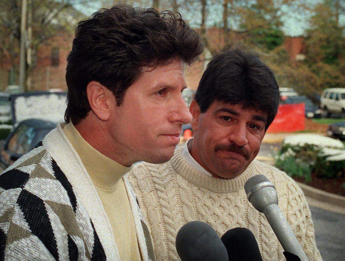 Donato Dalrymple, left, listens to a question as he and Sam Ciancio talk with reporters gathered outside of the NBC studios in Washington Sunday, April 9, 2000. The two fisherman who pulled Elian Gonzalez from the waters off Miami were scheduled to meet with his father Juan Miguel Gonzalez later in the day.