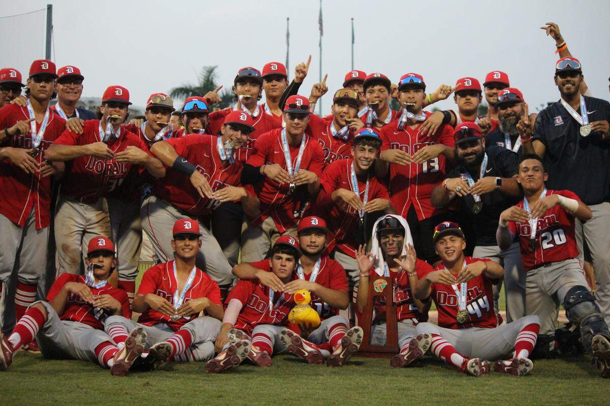 Doral Academy’s baseball team celebrates its first state championship on Saturday night at Hammond Stadium in Fort Myers.