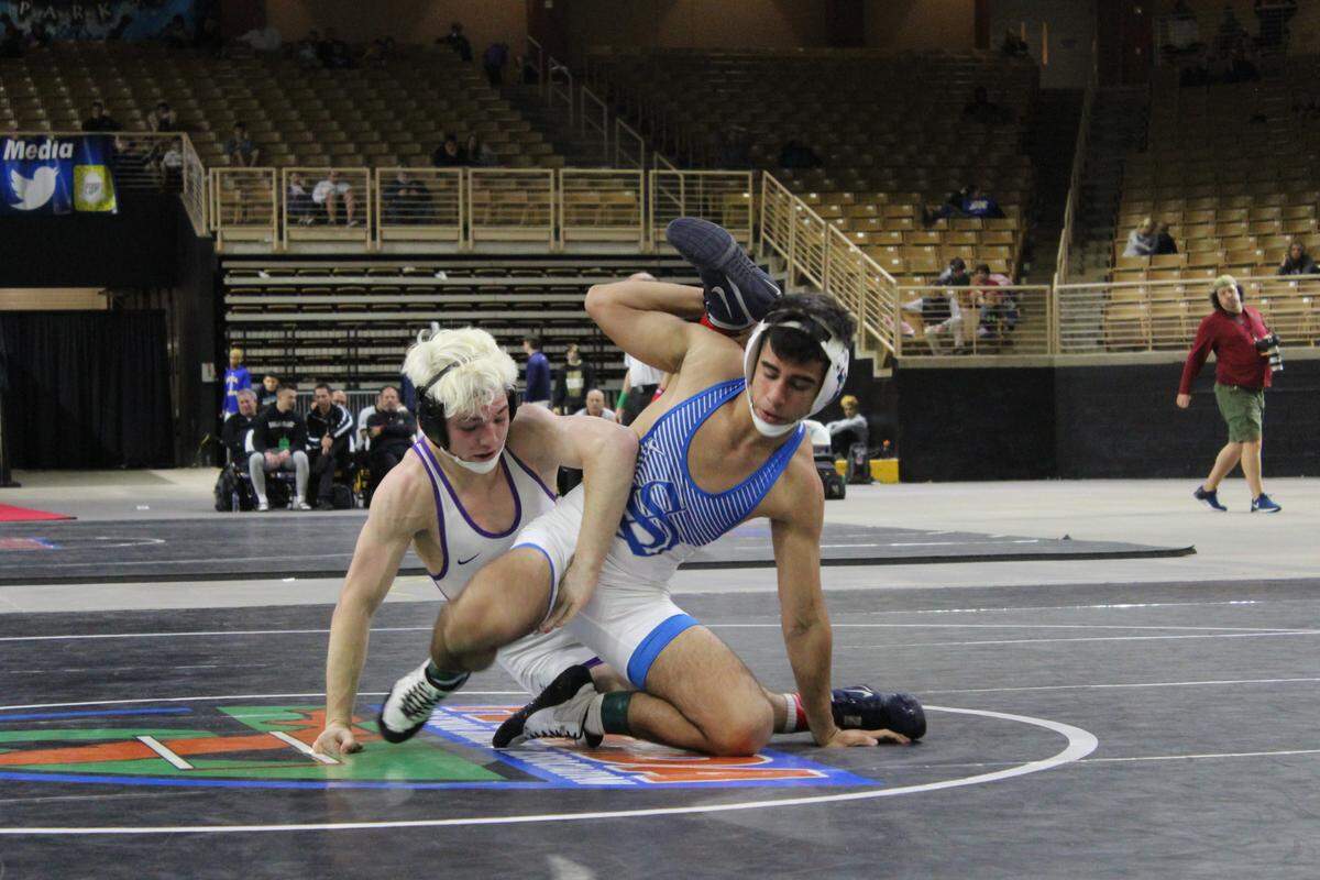 Teammates at Southwest just a year ago, Southwest’s Sebastian Melguizo (left) and Jose Gonzalez of South Dade met in the 3A 126 lbs. final. Melguizo won it 8-2.