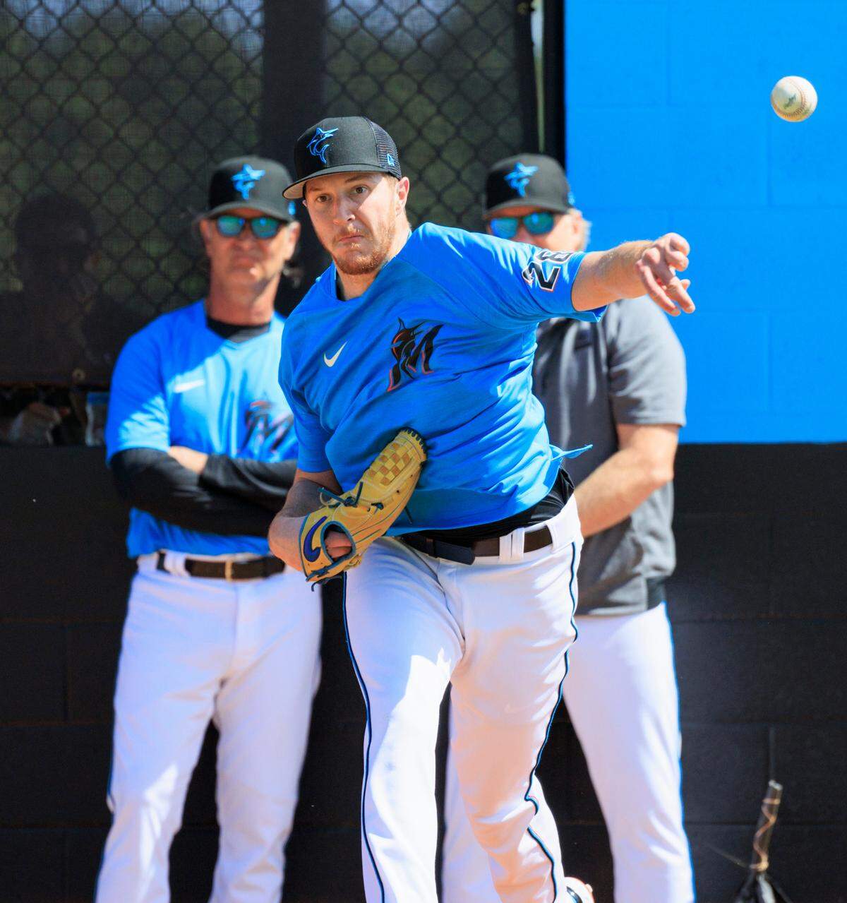 Miami Marlins manager Don Mattingly and Marlins pitching coach Mel Stottlemyre Jr look as Marlins pitcher Trevor Rogers throws during the first full-squad spring training workout at Roger Dean Stadium on Monday, March 14, 2022 in Jupiter, FL.