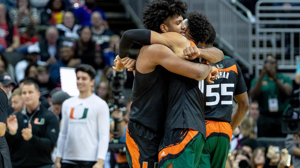 Miami forward Norchad Omier (15) hugs guard Jordan Miller (11) after defeating Houston 89-75 during a Sweet 16 college basketball game in the Midwest Regional of the NCAA Tournament Friday, March 24, 2023, in Kansas City.