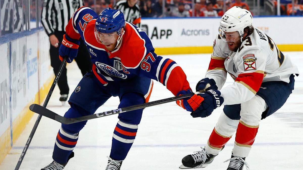 Jun 6, 2025; Edmonton, Alberta, CAN; Edmonton Oilers center Connor McDavid (97) skates past Florida Panthers center Carter Verhaeghe (23) during the third period in game two of the 2025 Stanley Cup Final at Rogers Place. Mandatory Credit: Perry Nelson-Imagn Images