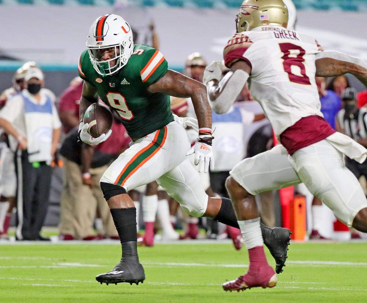 UM’s Brevin Jordan (9) scores a touchdown as FSU’s LaÕDamian Webb (8) fails to defend as the University of Miami host Florida State University Seminoles at Hardrock Stadium in Miami Gardens on Saturday, September 26, 2020.