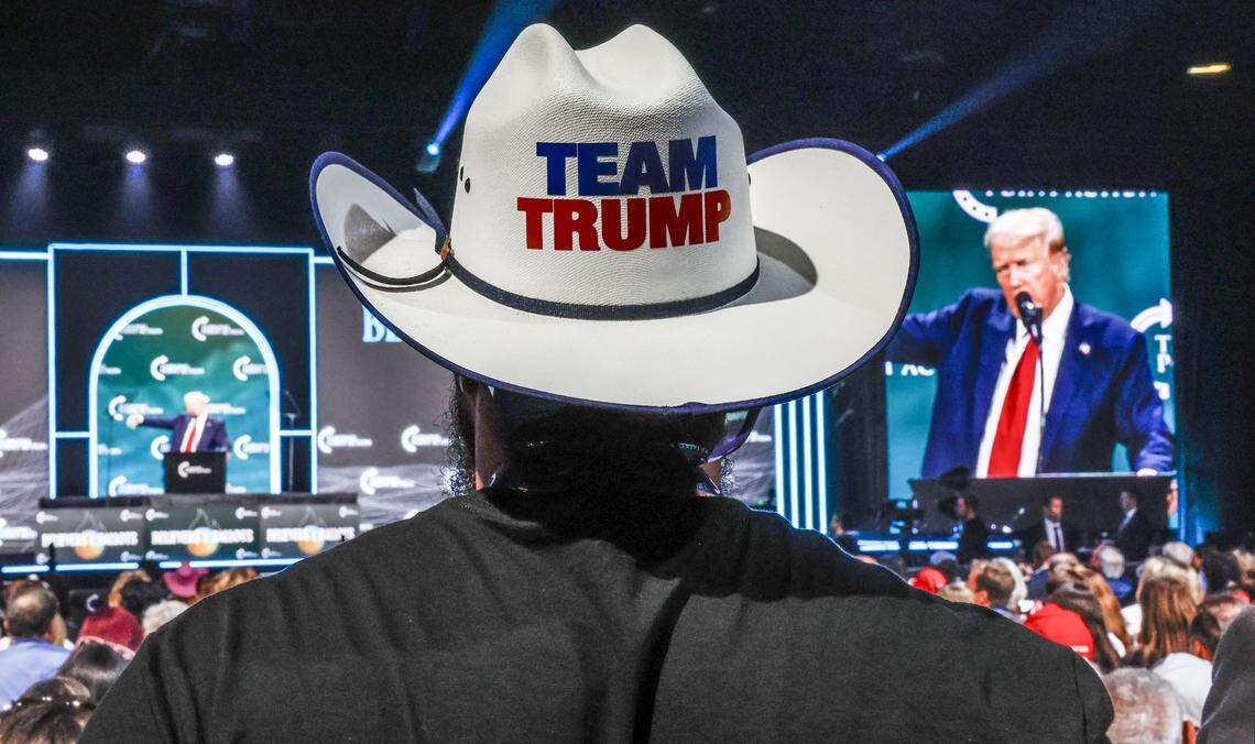 A supporter listens to former President Donald Trump speak during the Turning Point Believers Summit at the Palm Beach County Civic Center on Friday, July 26, 2024. 