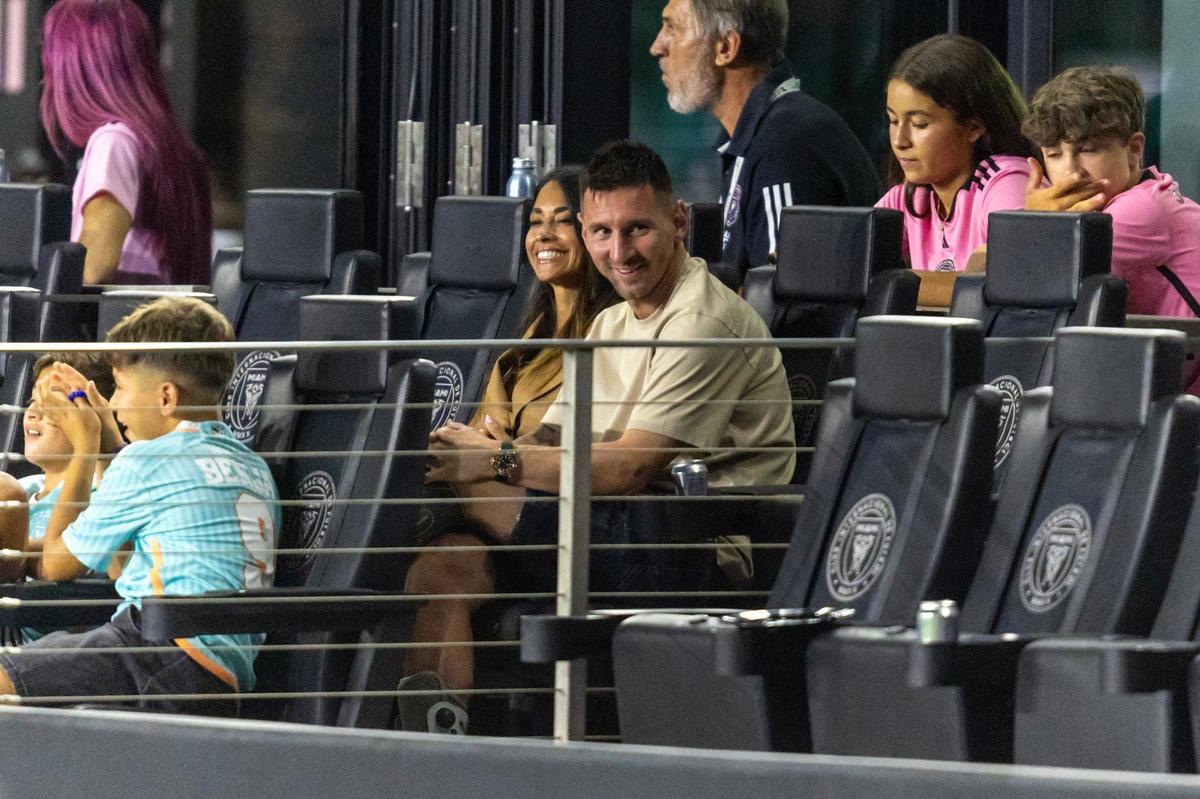 Inter Miami forward Lionel Messi sits with his wife Antonela Roccuzzo during a Leagues Cup match against Puebla at Chase Stadium on Saturday, July 27, 2024, in Fort Lauderdale, Fla.