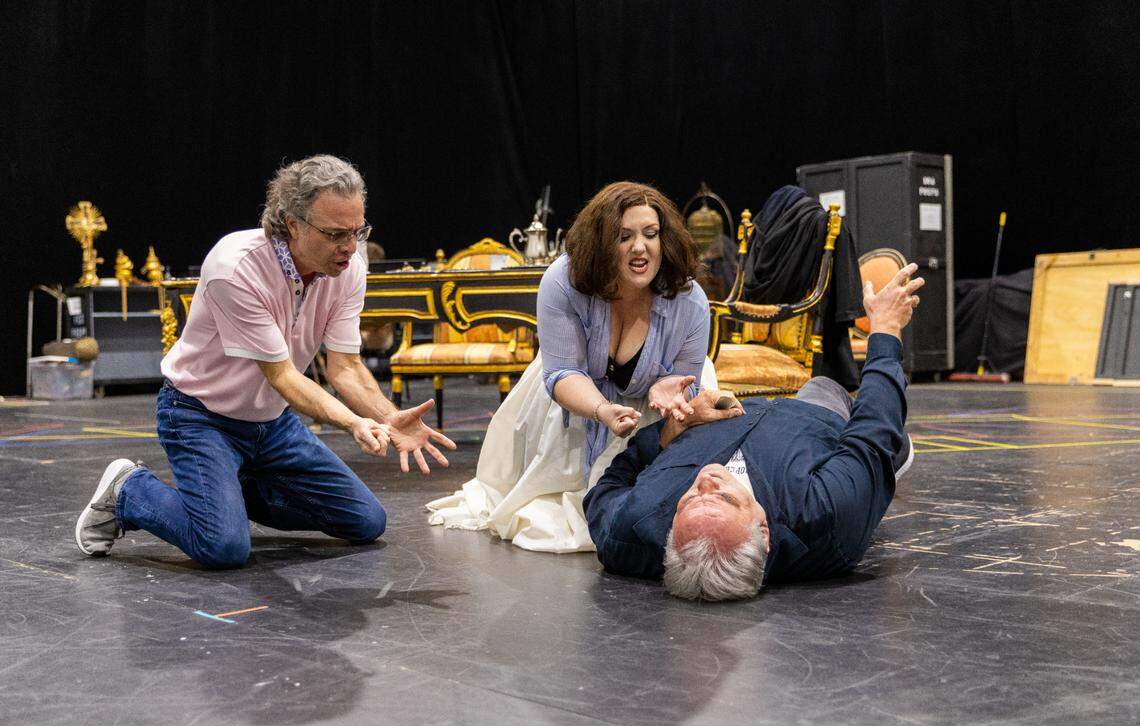 Director Jeffrey Marc Buchman in rehearsal for a scene in Act II of “Tosca” with Toni Marie Palmertree and Todd Thomas. (Photo courtesy of Eric Joannes)