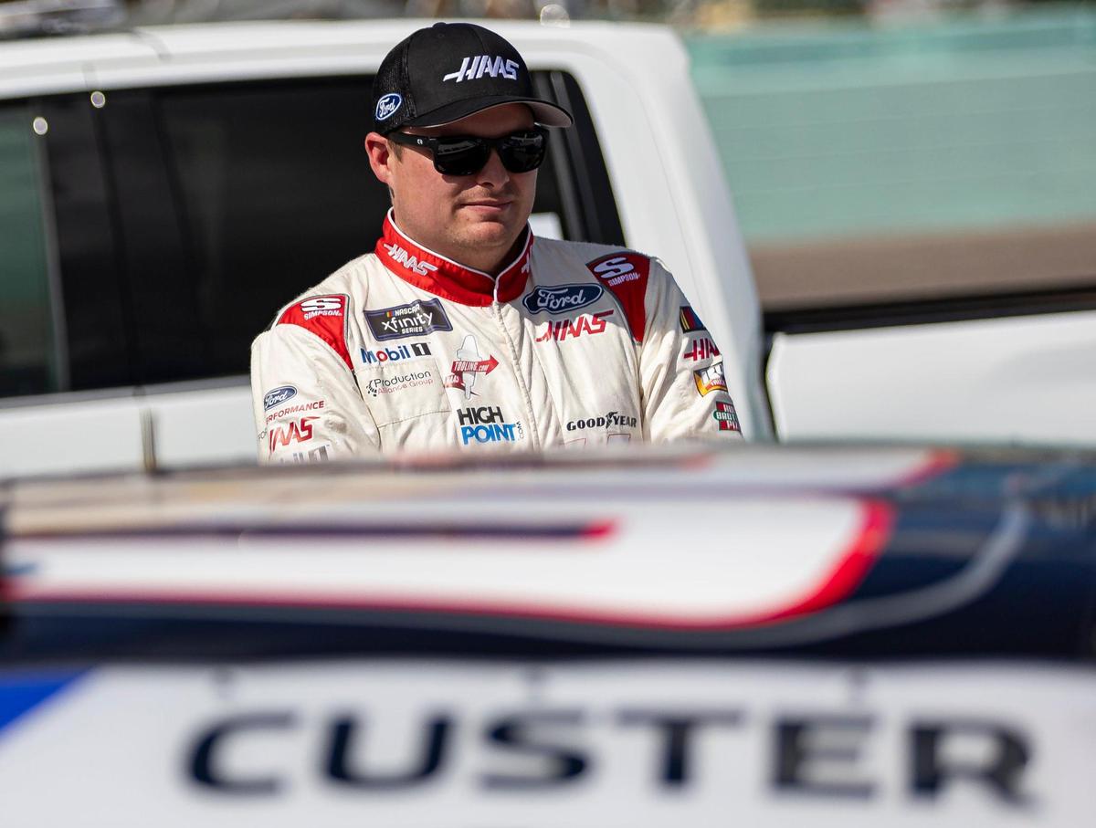 Cole Custer #00 with Stewart-Haas Racing looks at his car before participating in the Contender Boats 300 NASCAR Xfinity Series playoff race at the Homestead-Miami Speedway on Saturday, Oct. 21, 2023, in Homestead, Fla.