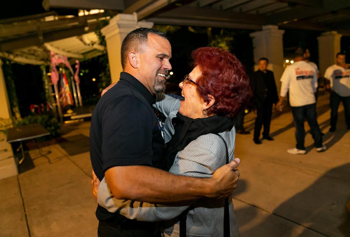 Luis Rodriguez hugs his mom, Ana Rodriguez, after winning his Hialeah councilman election runoff race at the Hialeah Park and Casino on Tuesday, November 16, 2021.