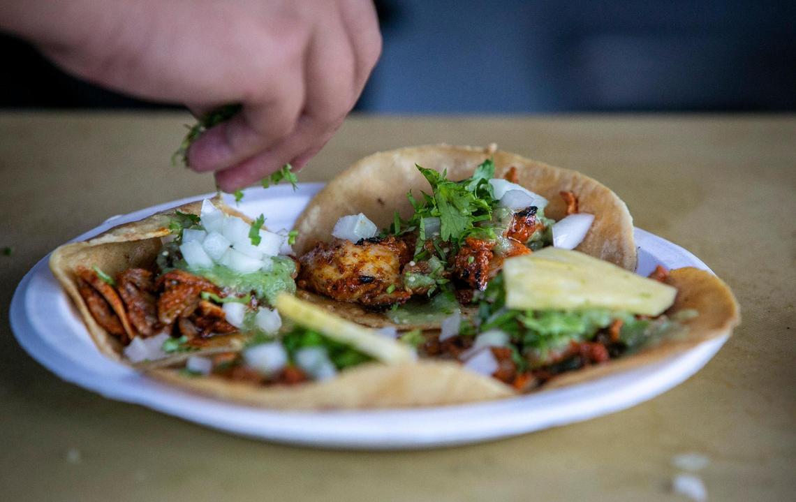 Eduardo Lara’s specialty are his tacos al pastor: pork that is roasted on a spit, charred at the tips, and served with slivers of roasted pineapple and topped with an onion-cilantro-lime salsa.