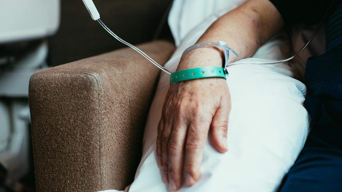 Old man patient hand in hospital