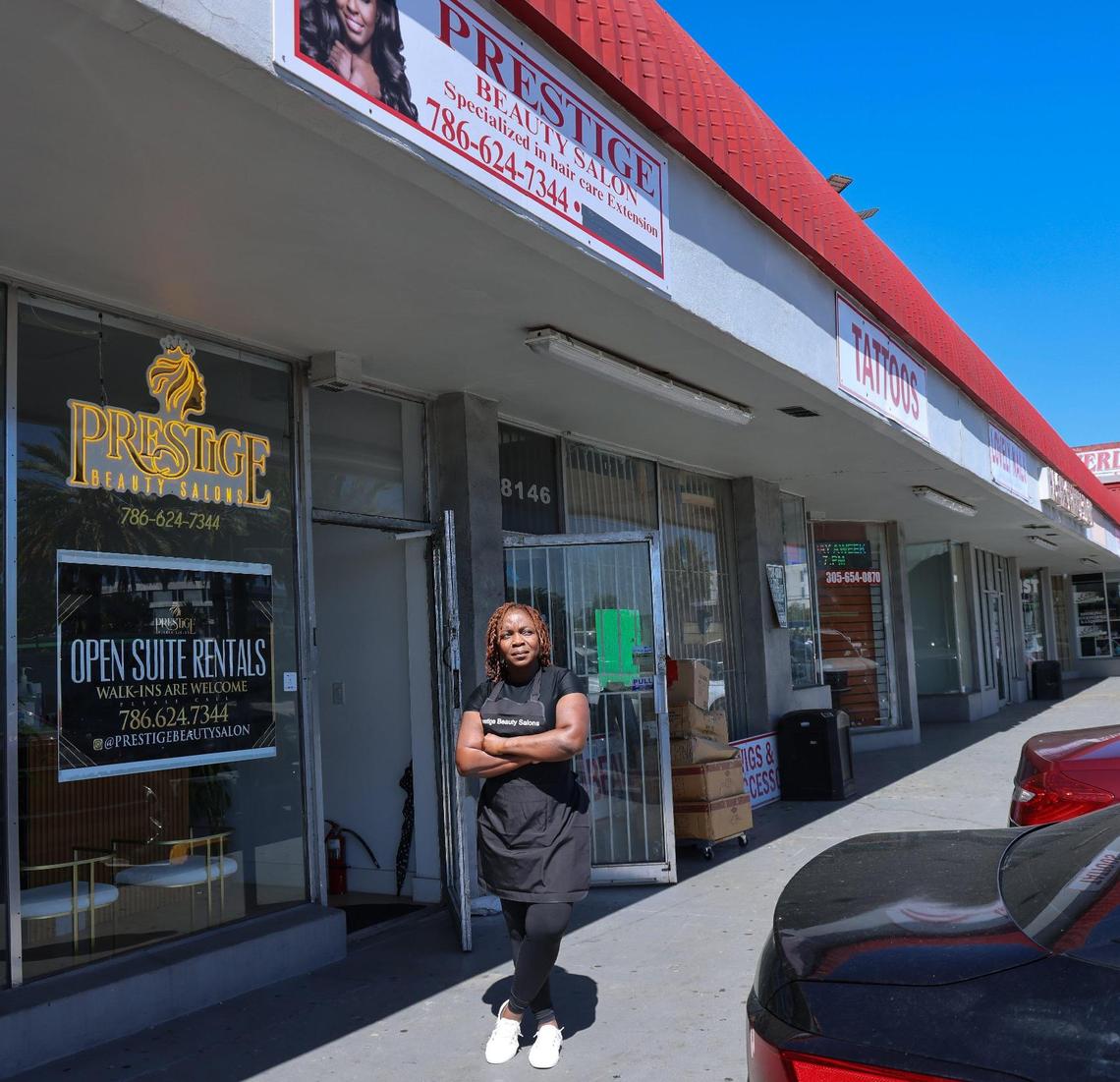 Hairstylist and beautician Nicole Ward stands outside her beauty salon, Prestige Beauty Salon at Cloverleaf Plaza in Miami Gardens. The new ownership plans to do improvements to the property.