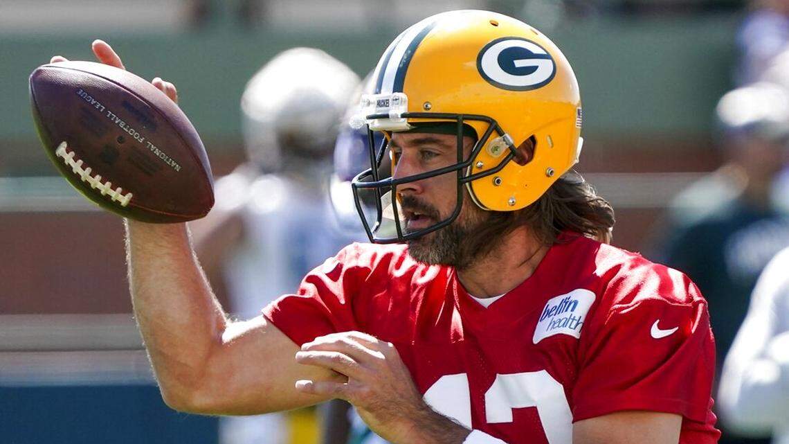 Green Bay Packers’ Aaron Rodgers runs a drill at the NFL football team’s practice field Saturday, July 30, 2022, in Green Bay, Wis. (AP Photo/Morry Gash)
