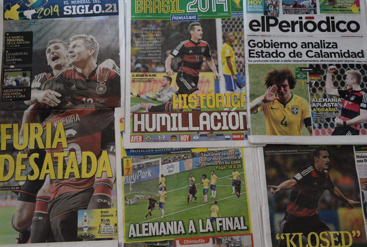 Picture of Guatemalan newspaper highlighting Germany's 7-1 record victory over Brazil in a FIFA World Cup Brazil 2014 semi-final, a day after the match in Guatemala City on July 9, 2014.  AFP PHOTO / Johan ORDONEZ (Photo by JOHAN ORDONEZ / AFP via Getty Images)