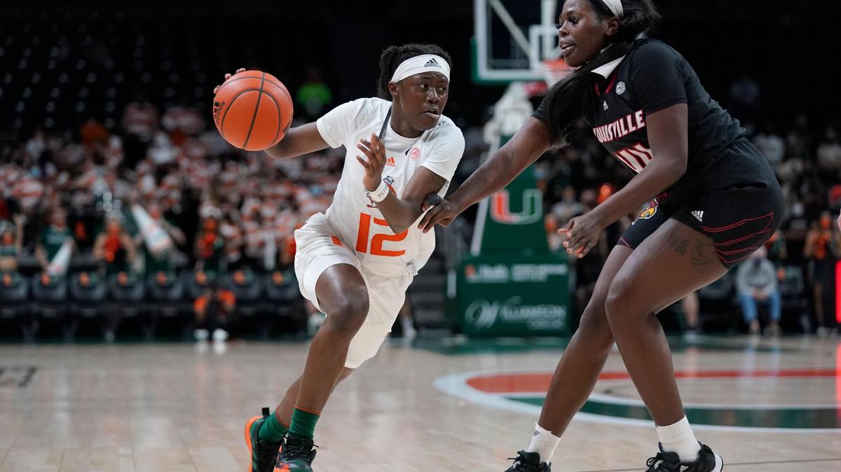 Miami freshman guard Ja’Leah Williams, driving against Louisville’s Olivia Cochran, led the Hurricanes with 16 points on 6-of-7 shooting.