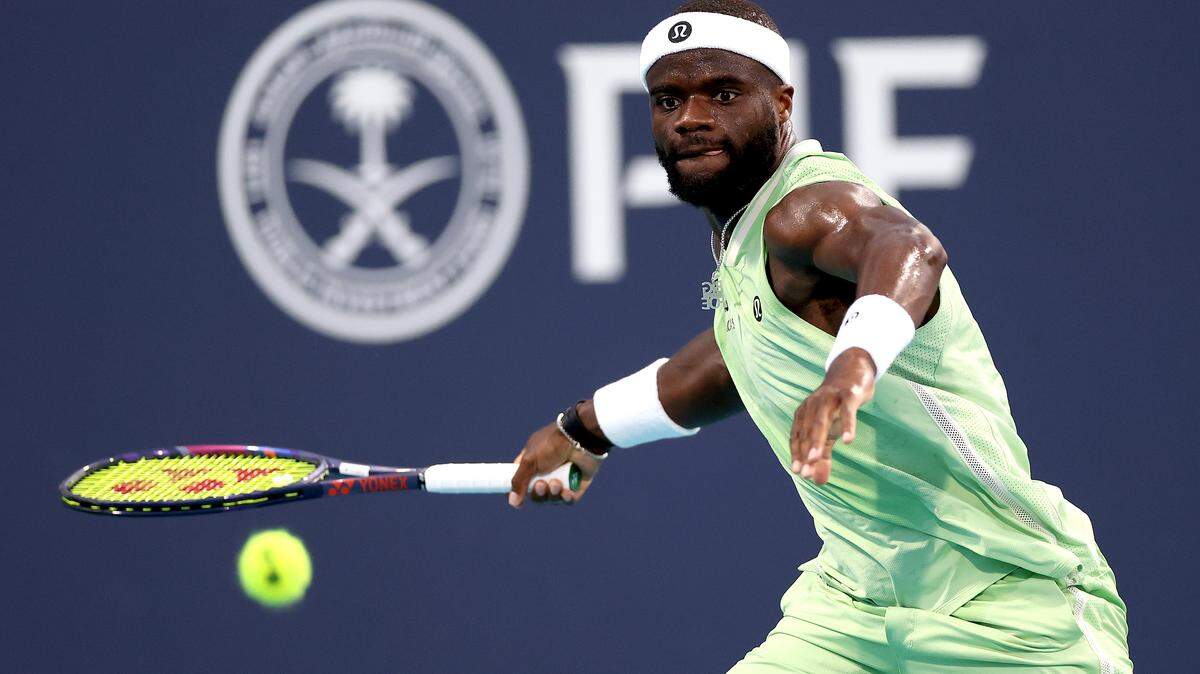 MIAMI GARDENS, FLORIDA - MARCH 24: Francis Tiafoe of the United States returns a shot to Terence Atmane of France on Day 8 of the Miami Open Presented by Itau at Hard Rock Stadium on March 24, 2026 in Miami Gardens, Florida. (Photo by Matthew Stockman/Getty Images)
