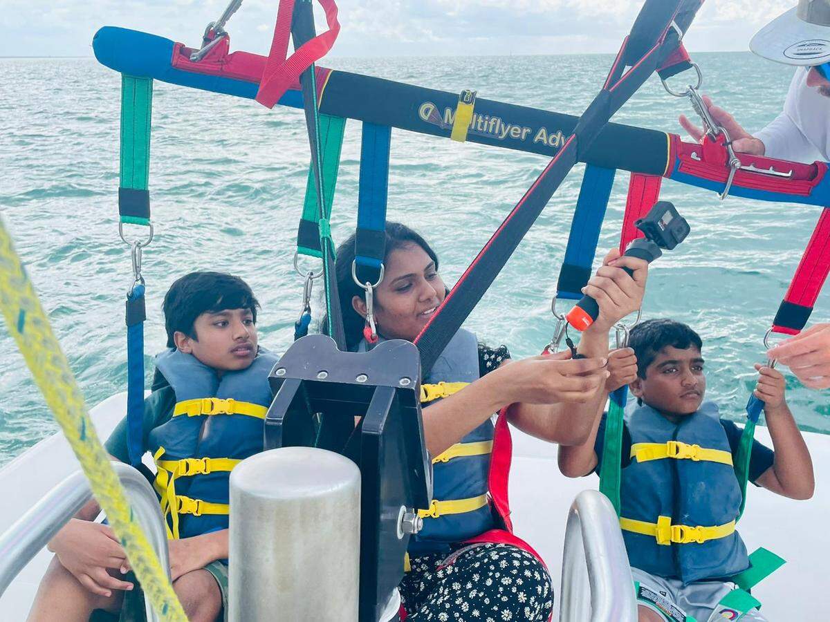 Supraja Alaparthi, center, died in a parasailing tragedy after a boat captain cut the parasailing cable tethering her to a vessel off the Florida Keys on May 30, 2022, according to authorities. Sriakshith Alaparthi, her 10-year-old son, left, and Vishant Sadda, her 9-year-old nephew, right, were also hurt but survived. 