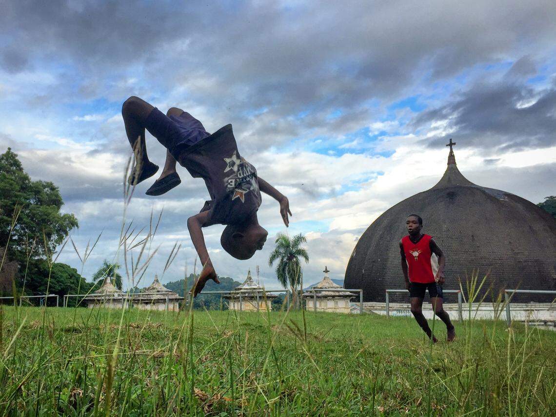 Children in the northern Haitian town of Milot play on the lawn of the Palace of Sans-Souci overlooking the wooden dome of Our Lady of the Immaculate Conception Church. Built after the Haitian Revolution, the church was destroyed in a fire on Monday, April 13, after its roof caught fire.