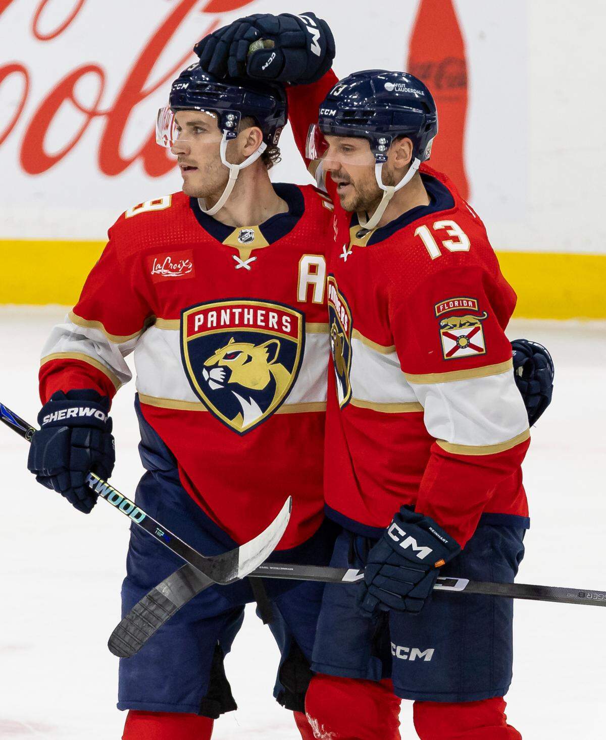 Florida Panthers center Sam Reinhart (13) celebrates with left wing Matthew Tkachuk (19) after scoring a goal against the Colorado Avalanche in the first period of their NHL game at the Amerant Bank Arena on Saturday, Feb. 10, 2024, in Sunrise, Fla.