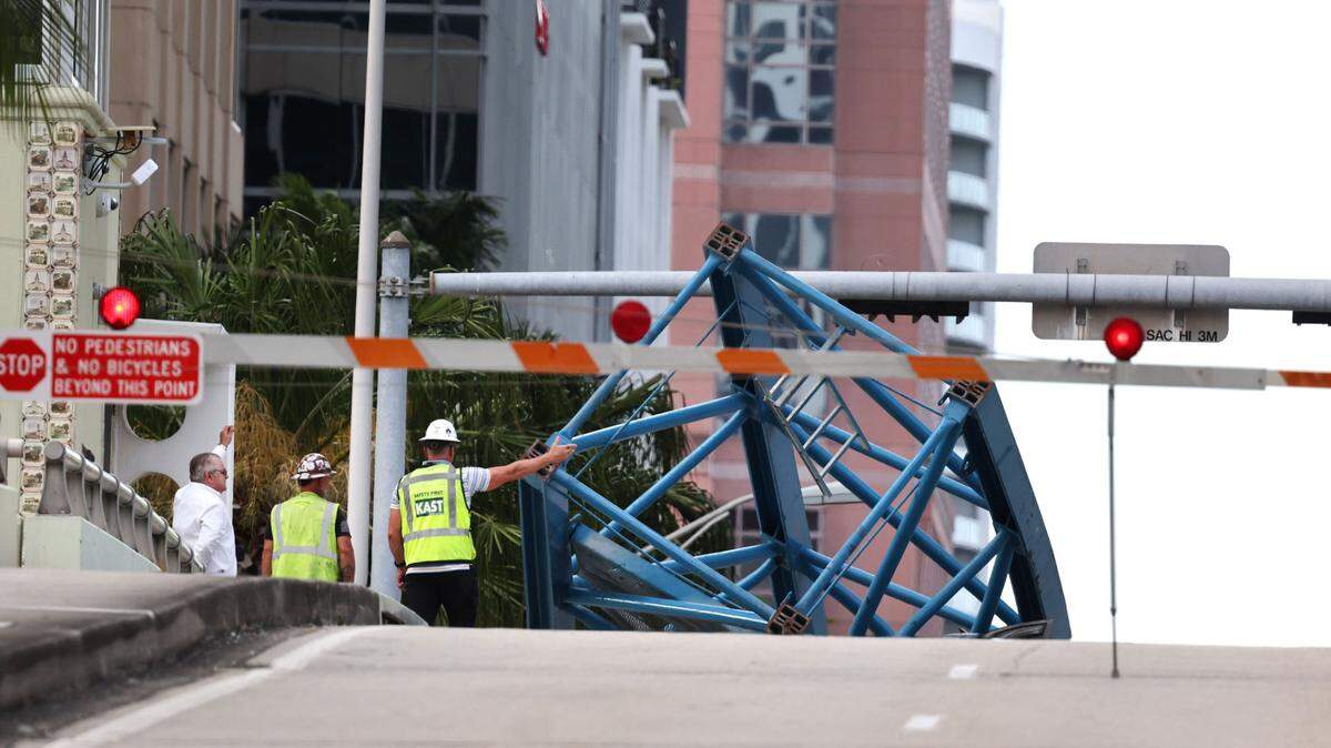 A construction worker was killed and two people were taken to the hospital after a portion of a crane dropped onto the Southeast Third Avenue bridge over the New River in downtown Fort Lauderdale on Thursday afternoon, April 4, 2024. (Carline Jean/South Florida Sun Sentinel)