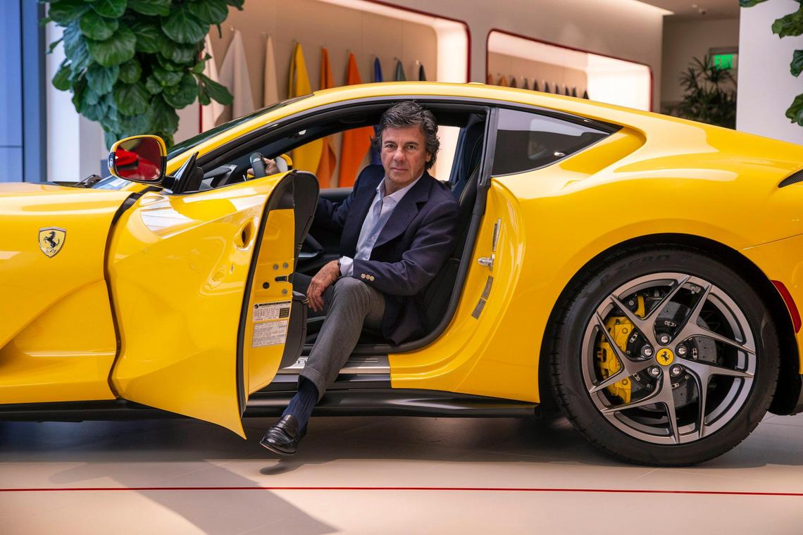 Ugo Colombo, owner of The Collection, sits in a Ferrari inside his new showroom for the Italian sports-car brand on Biscayne Boulevard in Miami.