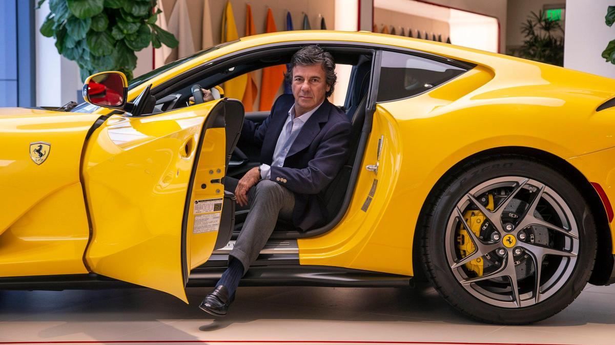 Developer Ugo Colombo, owner of The Collection, sits in a Ferrari inside his Biscayne Boulevard showroom for the Italian sports-car brand.