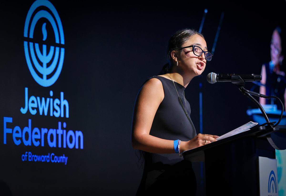 Keynote speaker Karni Guez, commander of the all-female tank unit who fought on October 7, gives her remarks during a commemoration event hosted by the Jewish Federation of Broward County. The event marked the second anniversary of the tragic attacks in Israel on October 7, 2023.
